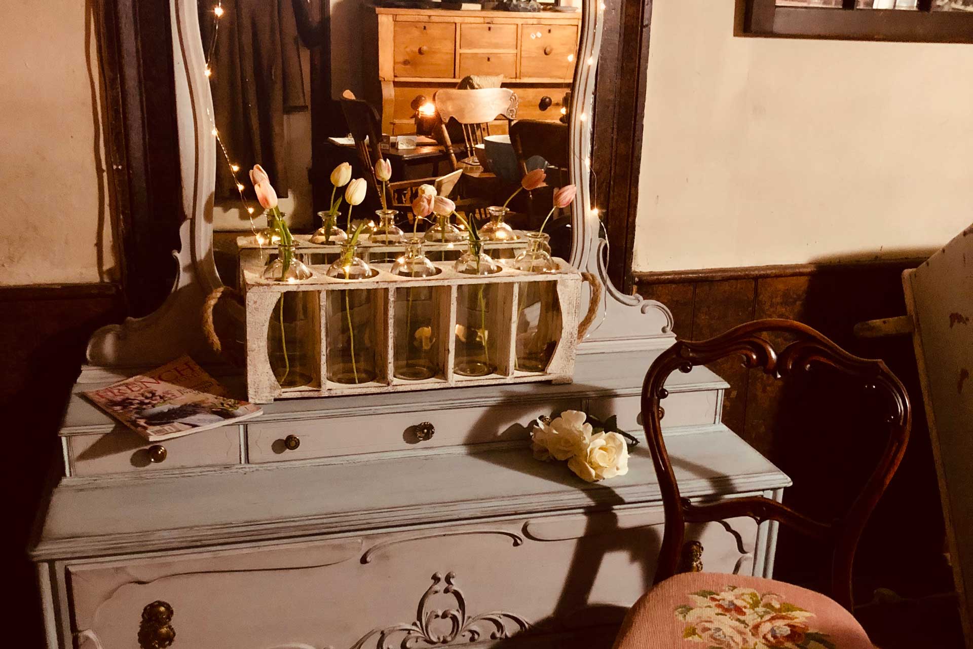 antique painted dresser with mirror and chair in front