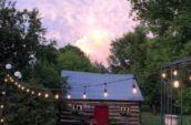 country side antiques log house exterior at dusk