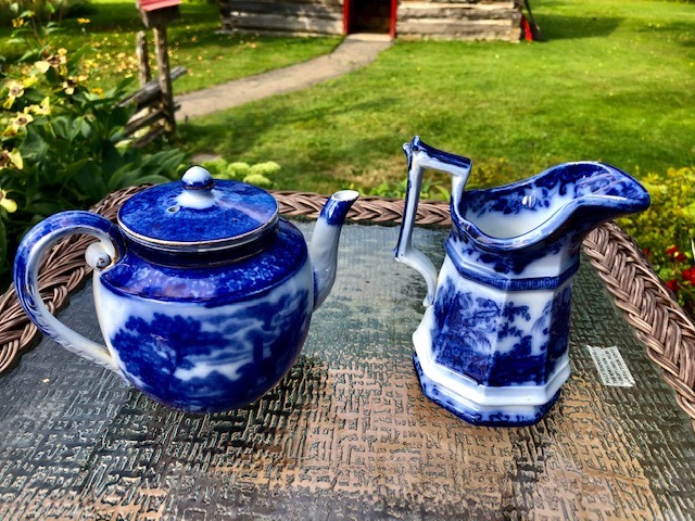 two ceramic teapots on a table