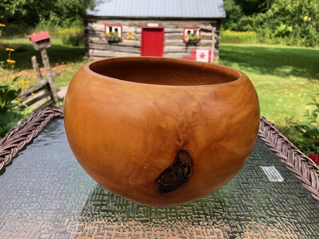 brown wooden bowl on top of a table