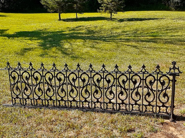 fence on a grassy field.