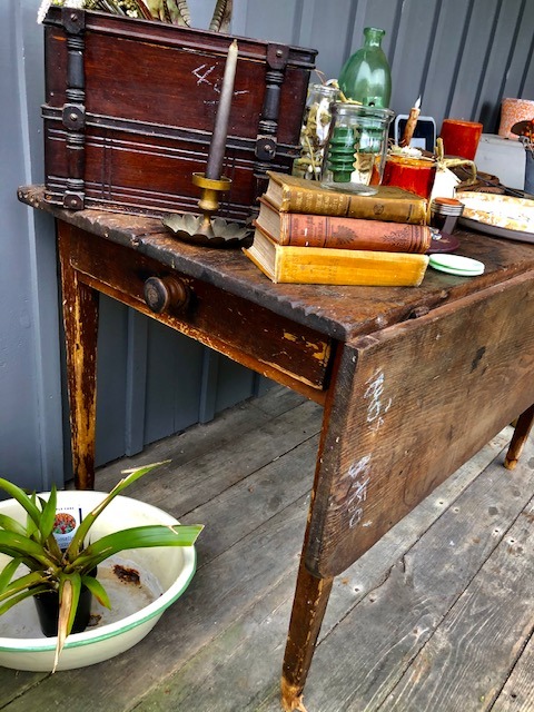 wooden table with single drawer and folding side