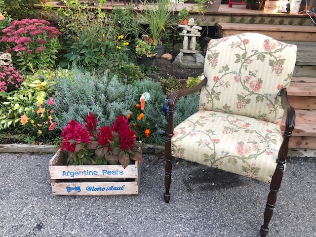 antique upholstered chair with floral design