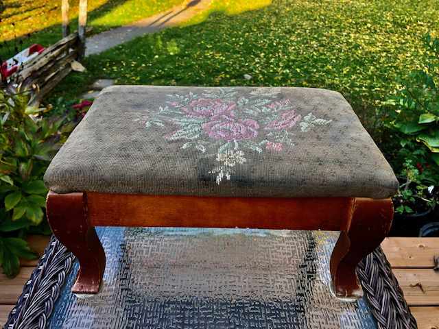 footrest embroidered with colourful floral display