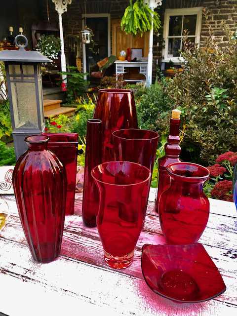 various red glass bowls and vases