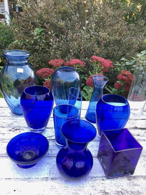 various blue glass bowls and vases