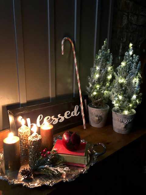 collection of christmas ornaments around a sign saying "blessed"