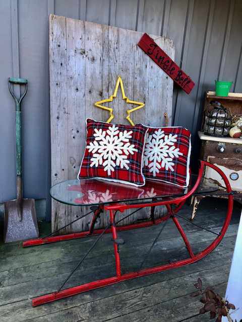 sleigh shaped coffee table with glass top