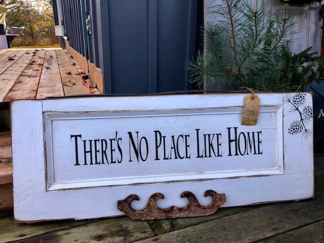 "there's no place like home" sign