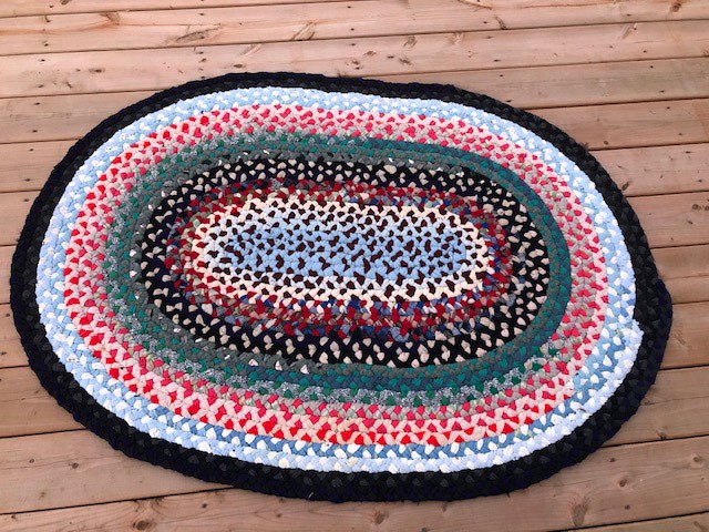multi-coloured oval rug