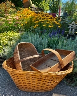 a large basket with two smaller baskets inside