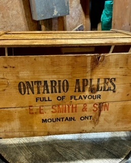 a wooden crate with ontario apples stencilled on